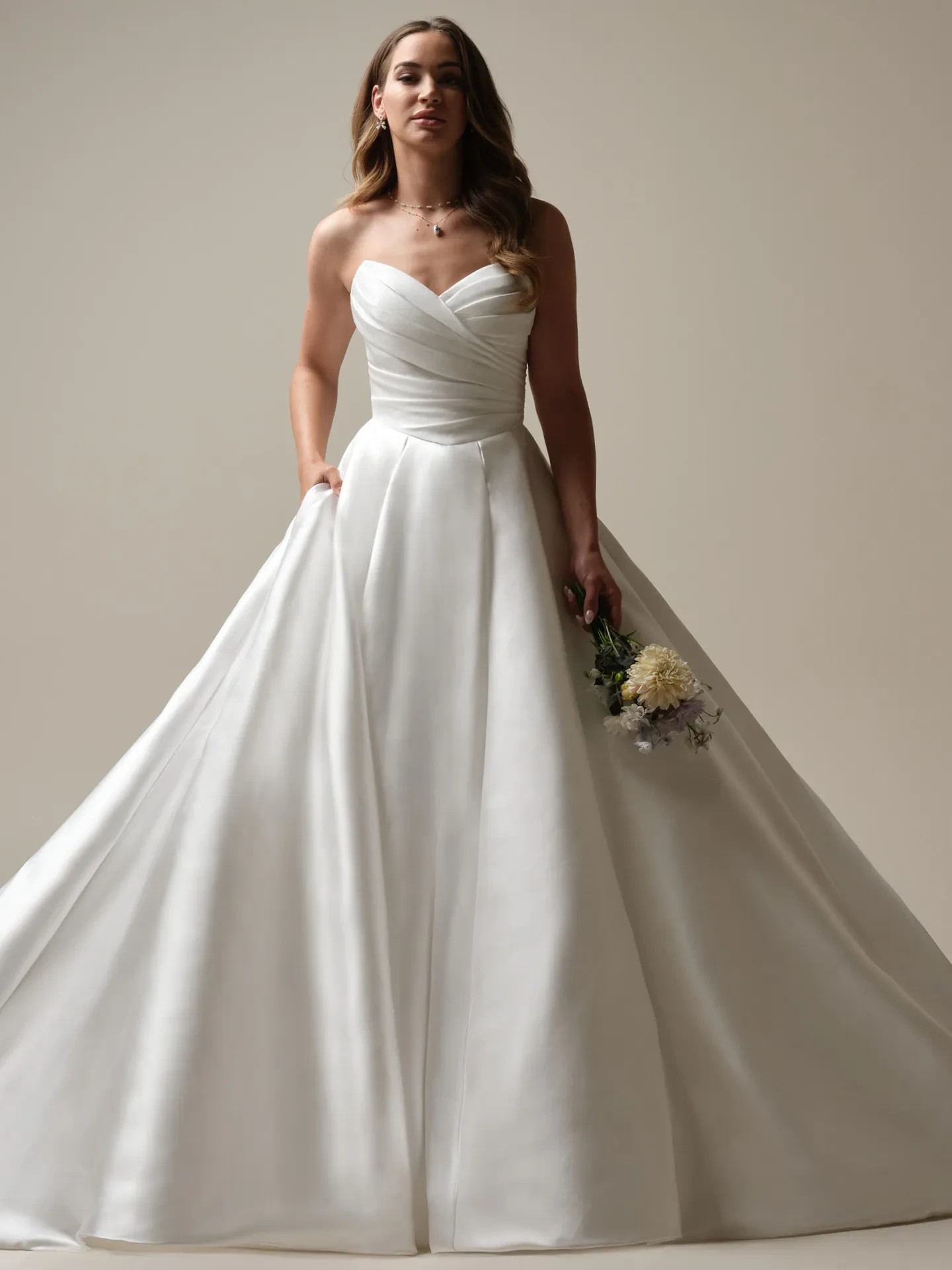 Model wearing a white gown by Maggie Sottero